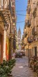 The facades of Sicilian restaurants and pizzerias in an alleyway in Old Town Palermo in Sicily, Italy